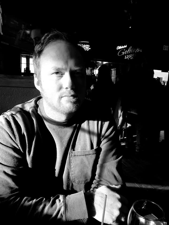 Justin Cronk, photographed in black and white